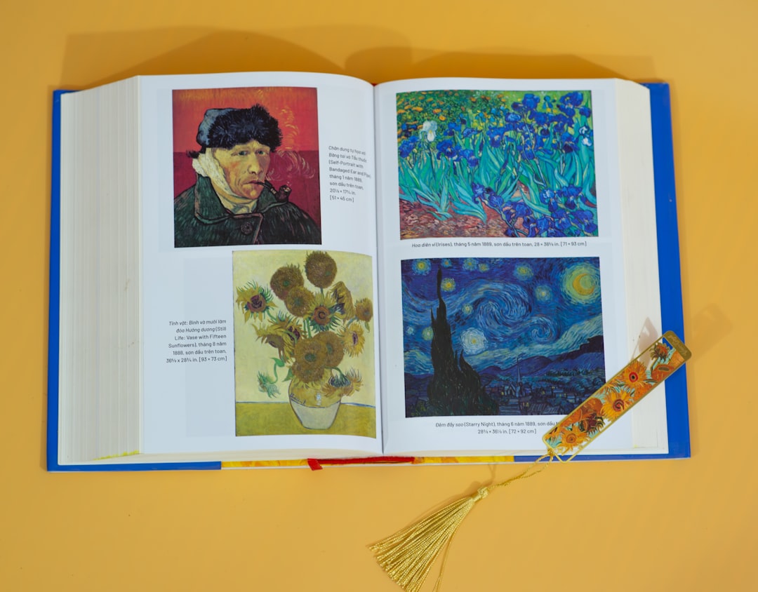 Photo by Trung Manh cong an open book with pictures of a man and flowers